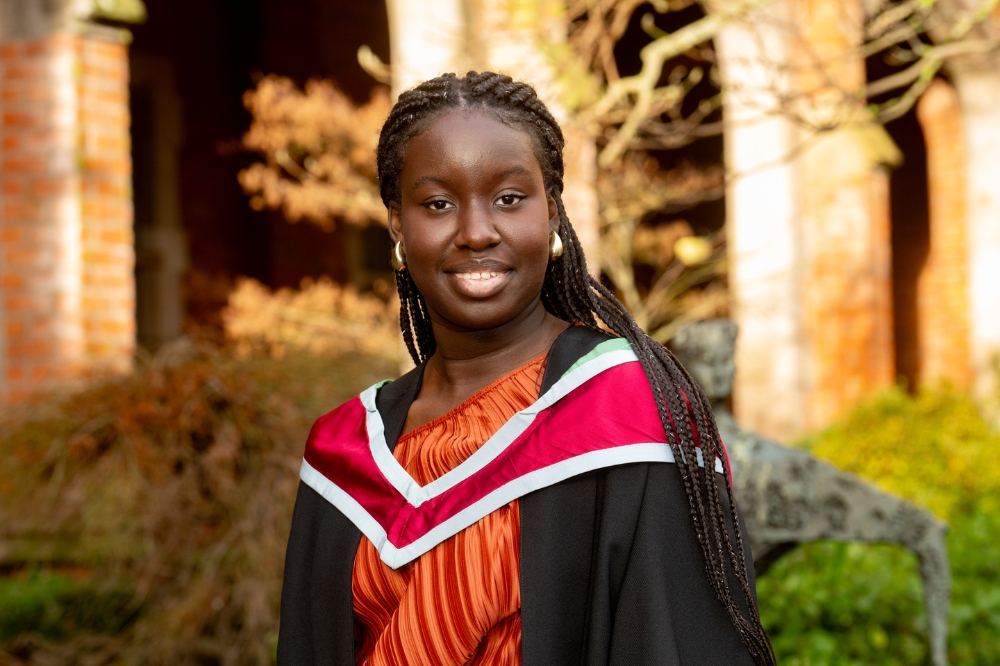 smiling International student celebrates graduating at Winter graduations 2023