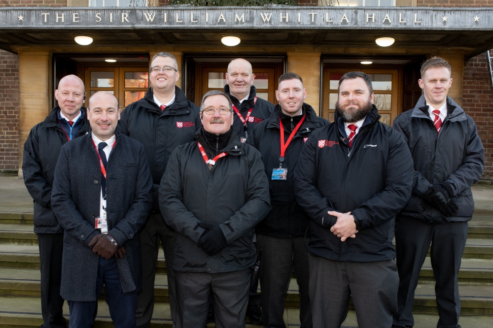 Queen's Security Team pose outside the Whitla Hall at Winter graduations 2023