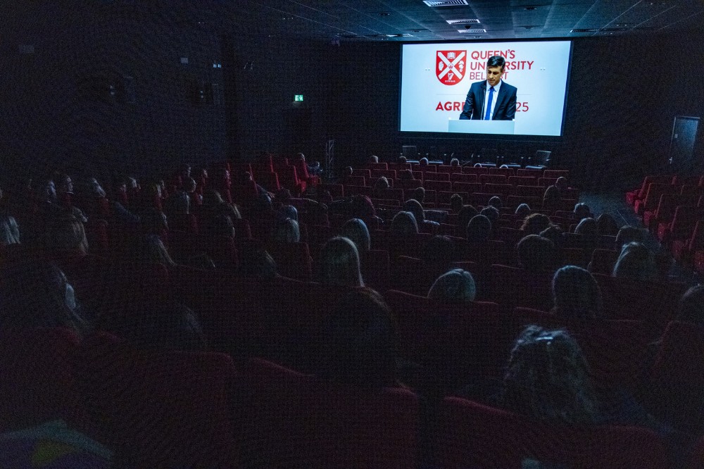 staff in the QFT watching a clip of Rishi Sunak during the screening of 'Delivering the Impossible: Agreement Twenty Five' documentary