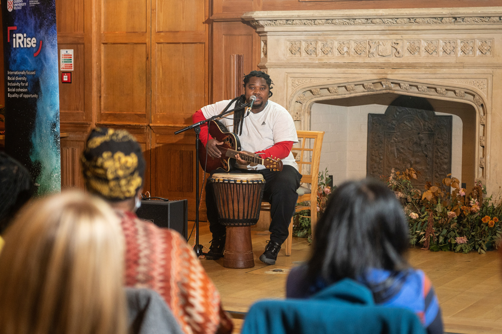 musician playing in QUB Great Hall for Black History Month 2021