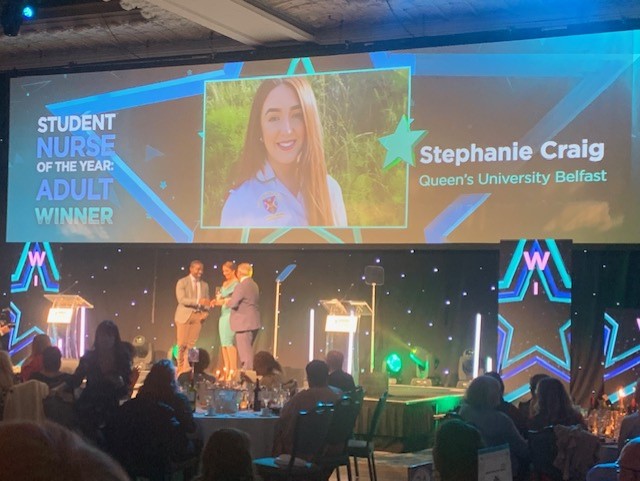 Stephanie Craig receiving award on stage at Student Nursing Times Awards 2021