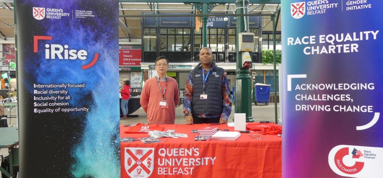 Dr  Liang Wang and Jamie-Lukas Campbell at the iRise-Racial Equality Charter stall at the Black History Month expo, St George's Market