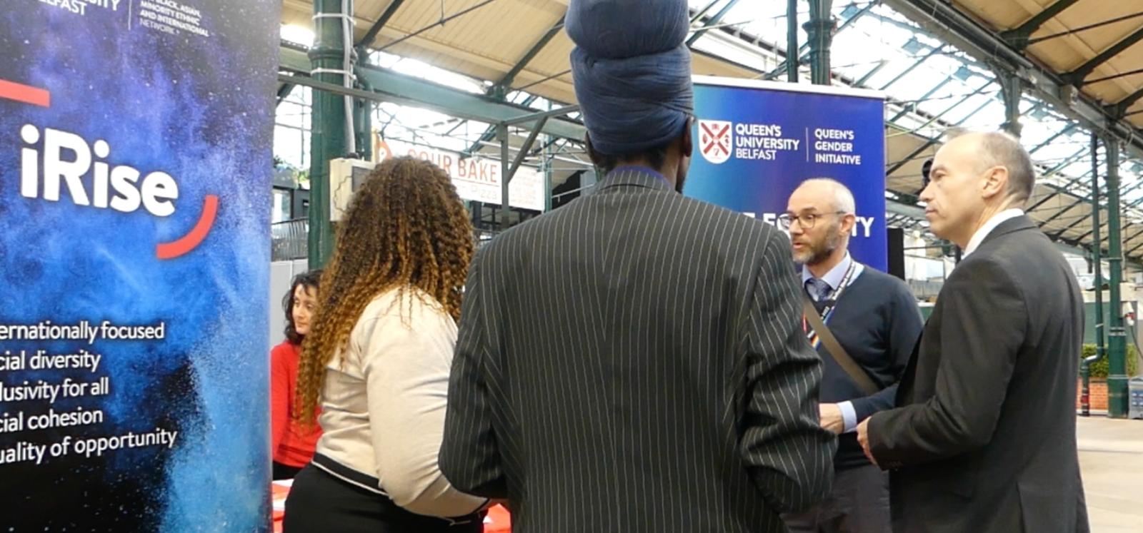 Secretary of State, Chris Heaton-Harris, at the QUB iRise stall at the Black History Month expo, St George's Market