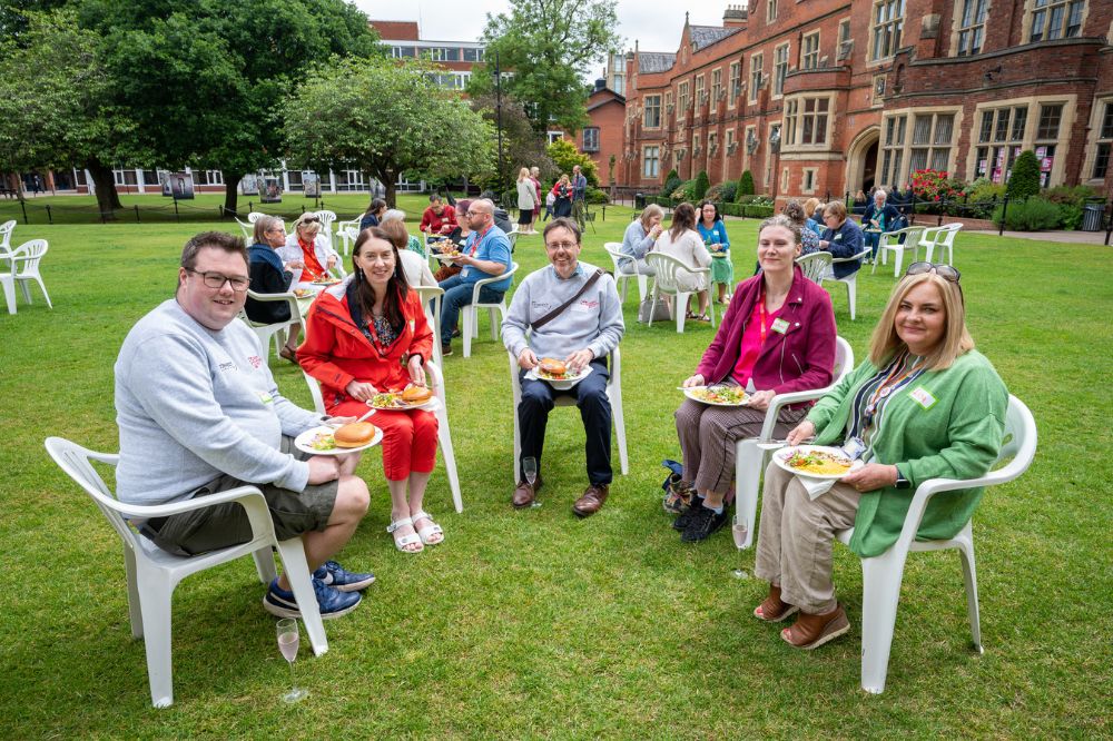 Staff carers enjoying a barbecue on Queen's quadrangle