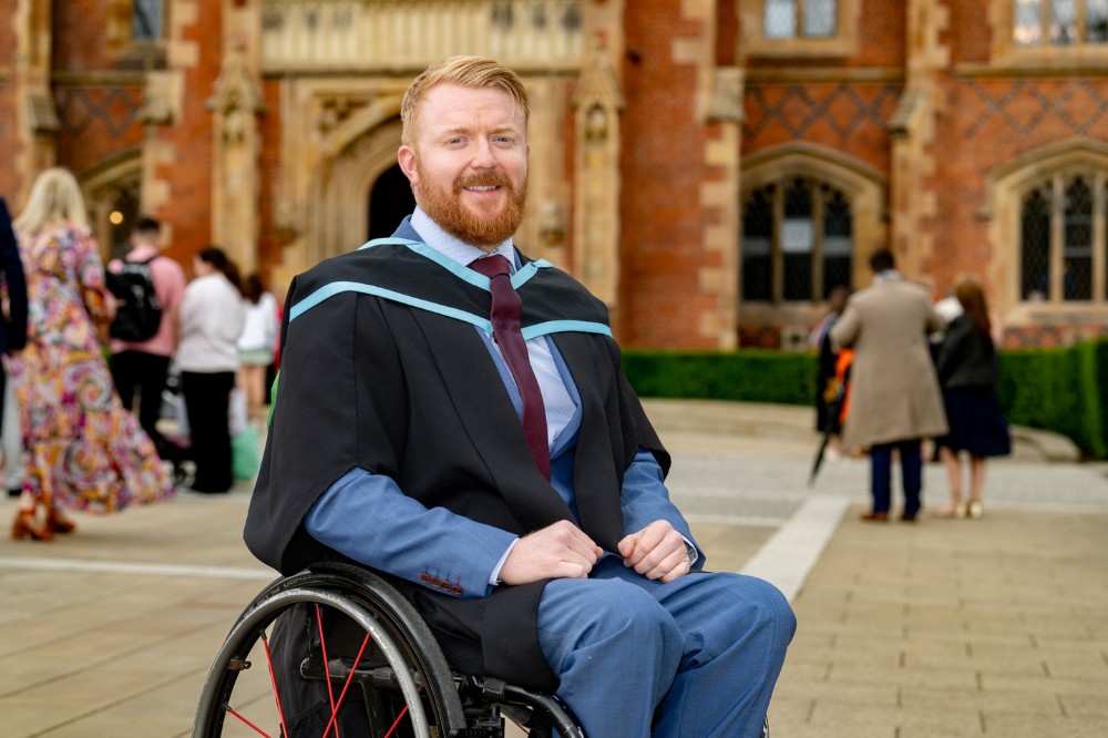 male wheelchair user celebrating his graduation success
