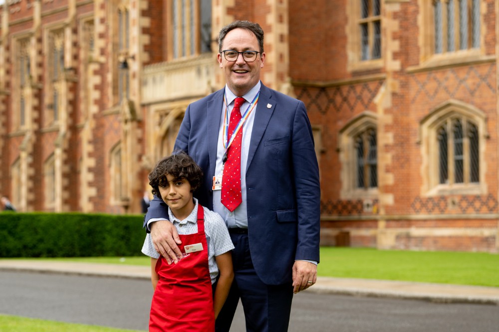 Brian Horgan, Campus Food and Drink, with his son Finn at QUB summer graduations outside the Lanyon Building