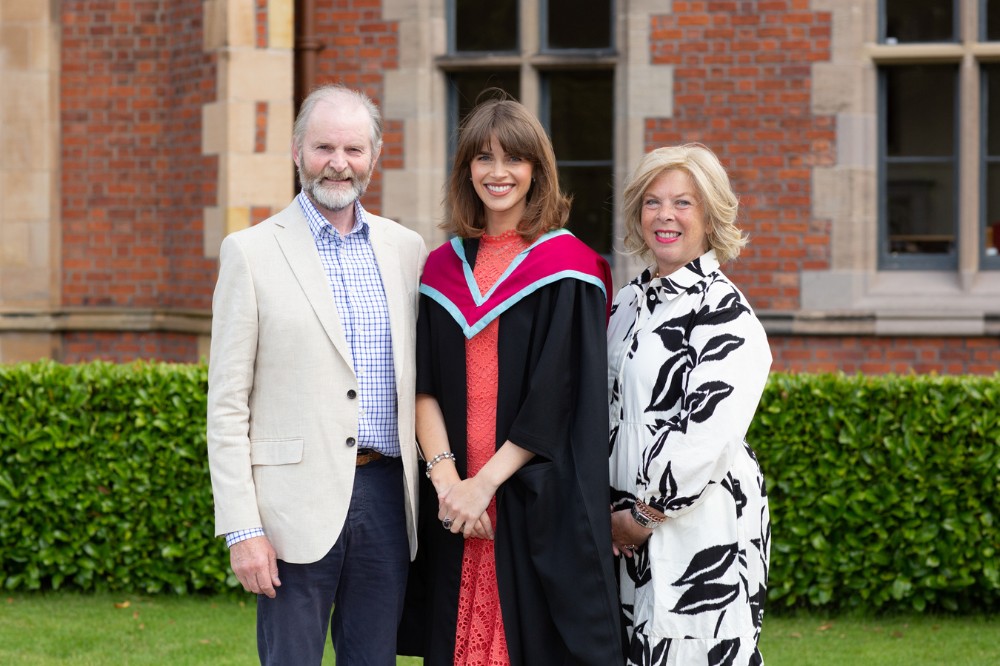 female graduate celebrating with her parents at summer graduations