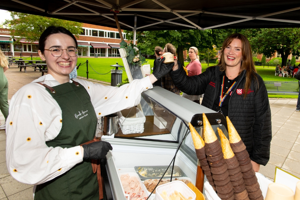 staff member being served ice cream at QUB Pride Picnic 2023