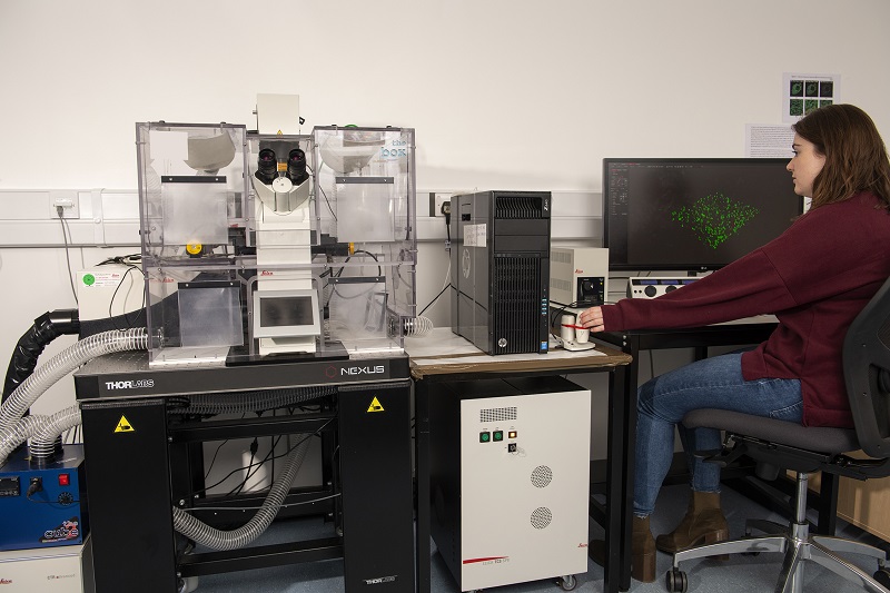 Student using Advanced Imaging microscope