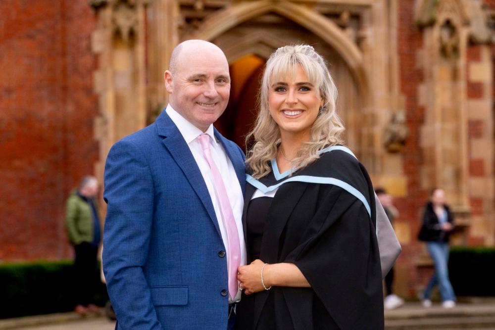 Father and daughter posing for graduation photo